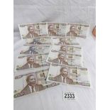 9 x 1000 and 2 x 100 Kenyan bank notes.