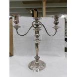 A silver plate candelabra.