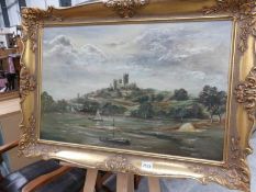 A gilt framed and glazed oil on canvas depicting a cathedral on a hill, signed Daeuetih ? Brar 1879.