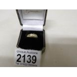 An 18kt gold ring set diamonds, size O, gross weight 4 grams.