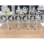 A set of 4 brass 'Pricket' candlesticks.