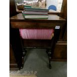 A Victorian walnut sewing table.