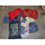 A mixed lot of Chinese textiles includes a fine silk Chinese jacket,