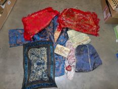 A mixed lot of Chinese textiles includes a fine silk Chinese jacket,