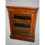 A Victorian walnut and marquetry pier cabinet.
