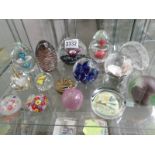 A collection of glass paperweights.