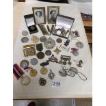A mixed lot of old medals, medallions, badges etc.