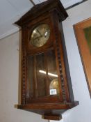 An oak wall clock.