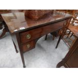 A mahogany desk with glass top.