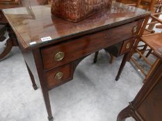 A mahogany desk with glass top.