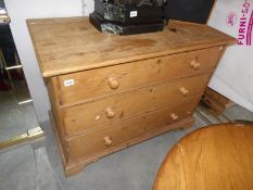 A pine 3 drawer chest.