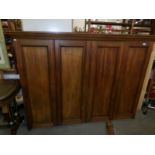 A 4 door mahogany school cupboard.