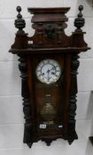 A Victorian mahogany 8 day wall clock, in working order.