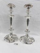 A pair of ornate antique Sheffield plate candlesticks.