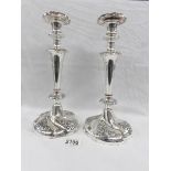 A pair of ornate antique Sheffield plate candlesticks.