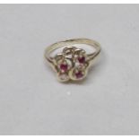 A 9ct 9ct gold ring set solo diamond and amethysts, size L, Gross weight 2 grams.