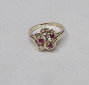 A 9ct 9ct gold ring set solo diamond and amethysts, size L, Gross weight 2 grams.