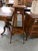 A mahogany inlaid pot stand.