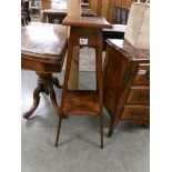 A mahogany inlaid pot stand.