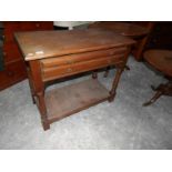 An oak 2 drawer table.
