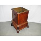 A small Victorian mahogany planter of square form.