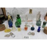 An interesting collection of old medicine, scent and other bottles etc.