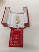 An 18ct gold Cartier wrist watch set diamonds.