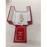 An 18ct gold Cartier wrist watch set diamonds.