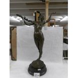 A nude bronze figure.