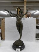 A nude bronze figure.