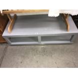 A low metal table (workshop/garage).