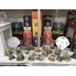 A quantity of boxed Lilliput Lane cottages and 2 sandwich plates with cups.