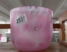 A pink Dartington glass vase.