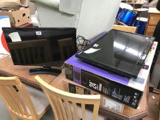 A Seiki 24" TV & an LG 24" smart TV (without stand)