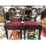 A pair of Victorian mahogany triple balloon back chairs