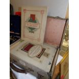 A small case containing approximately 28 sets of tea cards.