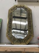 A decorative gilded mirror.