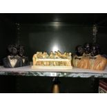 A Italian resin model of the last supper and 2 pottery figures of groups of singers.