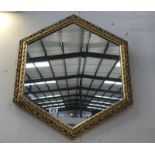 An ornate hexaganal mirror