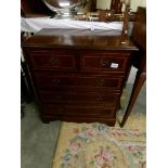 A small 2 over 3 mahogany inlaid chest of drawers,.