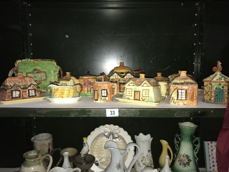 A shelf of Price Kensington and royal Winston etc, cottage ware, teapots butter dishes etc.