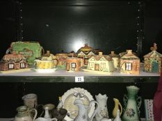 A shelf of Price Kensington and royal Winston etc, cottage ware, teapots butter dishes etc.