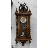 A Victorian mahogany Vienna wall clock, in working order.