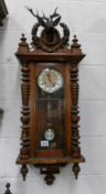 A Victorian mahogany Vienna wall clock, in working order.