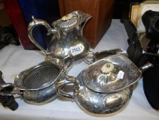 A 4 piece engraved silver plated tea set.