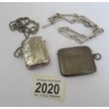 A silver vesta, a silver watch chain and a white metal vesta on chain.