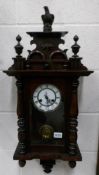 A Victorian mahogany 8 day wall clock, in working order.