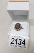 A 9ct gold ring set smoky quartz stone, size N. Gross weight 5 grams.