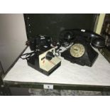 A vintage telephone, a Polaroid camera and 1 other.