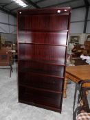 A mahogany book case.